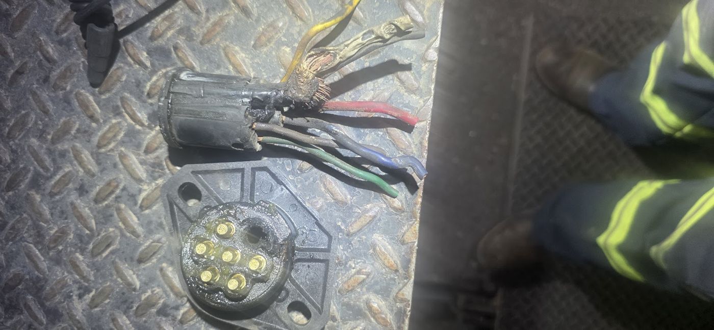A trailer wiring plug with the wires exposed